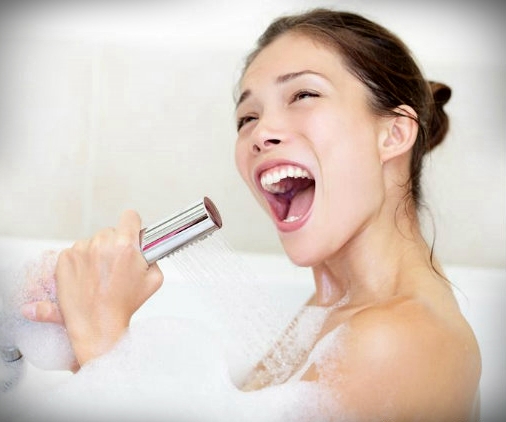 woman singing in bath shower